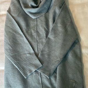 Super cute CK cowl neck sweater that will go perfect over leggings.